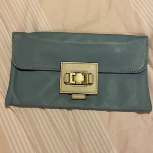Genuine leather baby blue and cream clutch